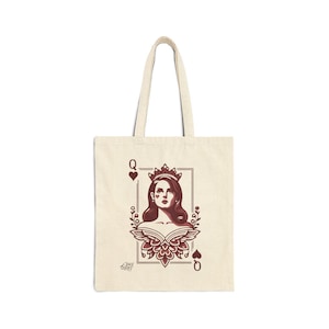 May include: Cream-colored tote bag featuring a maroon illustration of a queen from a deck of cards. The design includes a portrait of a woman wearing a crown, framed by floral elements and the letter "Q" with heart suit symbols.
