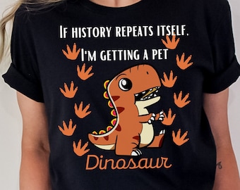 May include: Black t-shirt with a cartoon dinosaur and the text "If history repeats itself, I'm getting a pet dinosaur".
