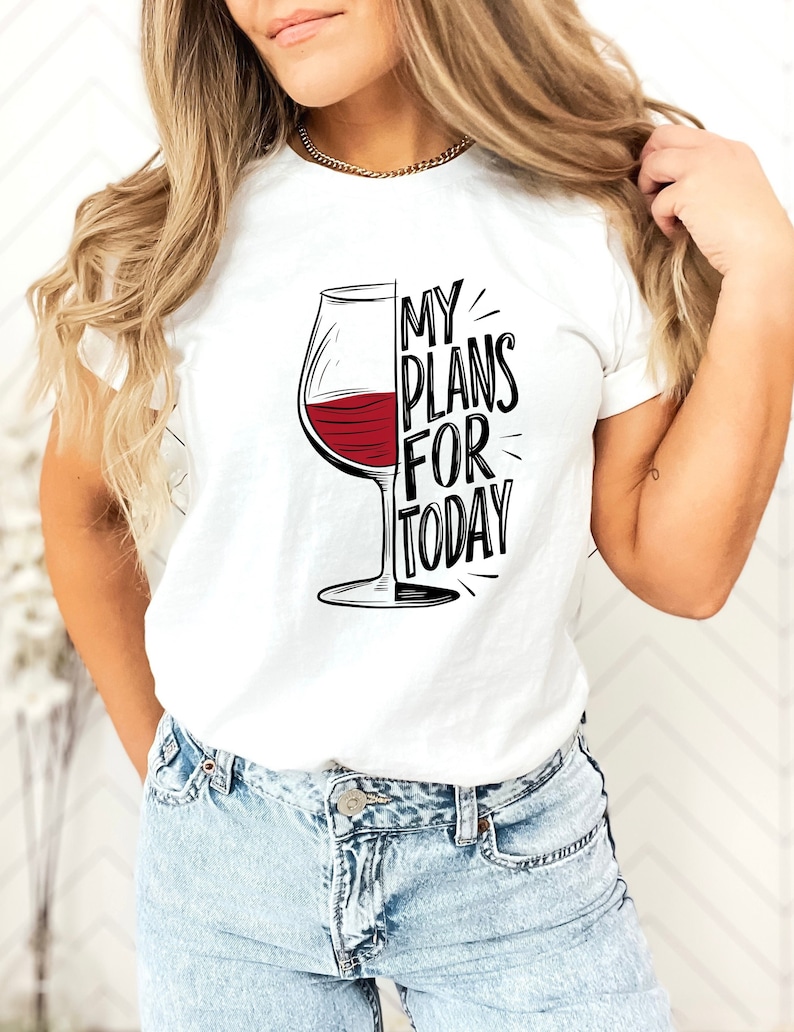 May include: White t-shirt with a black and red graphic of a wine glass and the text "My Plans For Today".