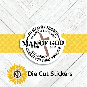 May include: A die-cut sticker with the text "NO WEAPON FORMED AGAINST YOU SHALL PROSPER" and "MAN OF GOD" with a cross graphic. The sticker also includes the text "ISAIAH 54:17" and "FLESH & BLOOD". A sunflower graphic with the number "20" and the words "Die Cut Stickers" are also present.
