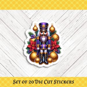 May include: A die-cut sticker featuring a purple and gold nutcracker soldier with a mustache, surrounded by gold ornaments, poinsettias, and greenery. The sticker has a white border and the text "SET OF 20 DIE CUT STICKERS".