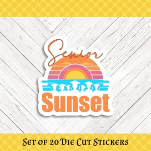 May include: A die-cut sticker with a sunset design in orange, pink, and yellow. The word "Senior" is written in a cursive font above the sunset, and "Sunset" is written in a bold font below. Graduation caps are in the design.