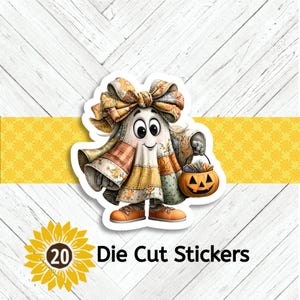 May include: A die-cut sticker featuring a friendly ghost character in a patchwork quilt costume, wearing a large bow and holding a jack-o'-lantern bucket. The sticker has a white border and the text "20 Die Cut Stickers" is at the bottom.