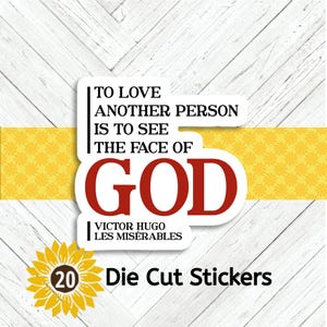 Puede incluir: Adhesivo blanco con la cita "TO LOVE ANOTHER PERSON IS TO SEE THE FACE OF GOD" en texto negro y rojo, atribuida a Victor Hugo, Les Misérables. Una flor de girasol amarilla y el texto "20 Die Cut Stickers" también están presentes.