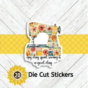 May include: A die-cut sticker featuring a watercolor illustration of a vintage sewing machine adorned with floral patterns in red, orange, and blue. The sticker includes the text "Any day spent sewing is a good day."