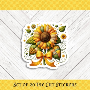 May include: A die-cut sticker featuring a detailed sunflower design with a patchwork effect. The sunflower has yellow, orange, and brown petals, green leaves, and a yellow bow. The text "SET OF 20 DIE CUT STICKERS" is at the bottom.