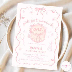 May include: Pink and white first birthday party invitation with a pink cake and the text "girls just wanna be one".