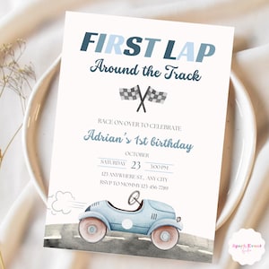 May include: Blue and white birthday invitation with a cartoon blue car and checkered flags. The text reads "First Lap Around the Track" and "Adrian's 1st Birthday".