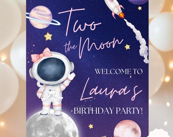 May include: A purple and blue welcome sign with a cartoon astronaut, stars, planets, and the text "Two the Moon, Welcome to Laura's Birthday Party!"