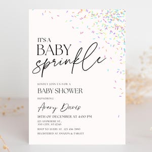 May include: A white baby shower invitation with a colorful sprinkle design. The text reads "It's a Baby Sprinkle" and includes the name Avery Davis, the date and time of the shower, and the address. It also includes RSVP information and where the guest of honor is registered.