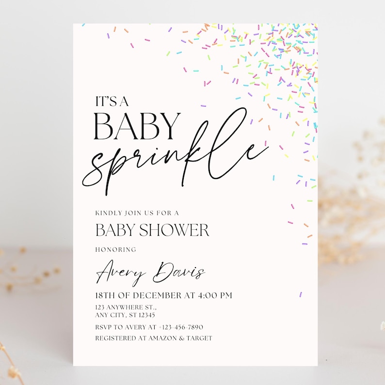 May include: A white baby shower invitation with a colorful sprinkle design. The text reads "It's a Baby Sprinkle" and includes the name Avery Davis, the date and time of the shower, and the address. It also includes RSVP information and where the guest of honor is registered.