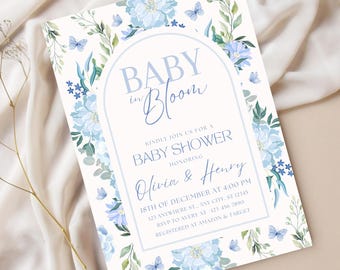 May include: A baby shower invitation with a blue floral design and the text "Baby in Bloom" and "Olivia & Henry".