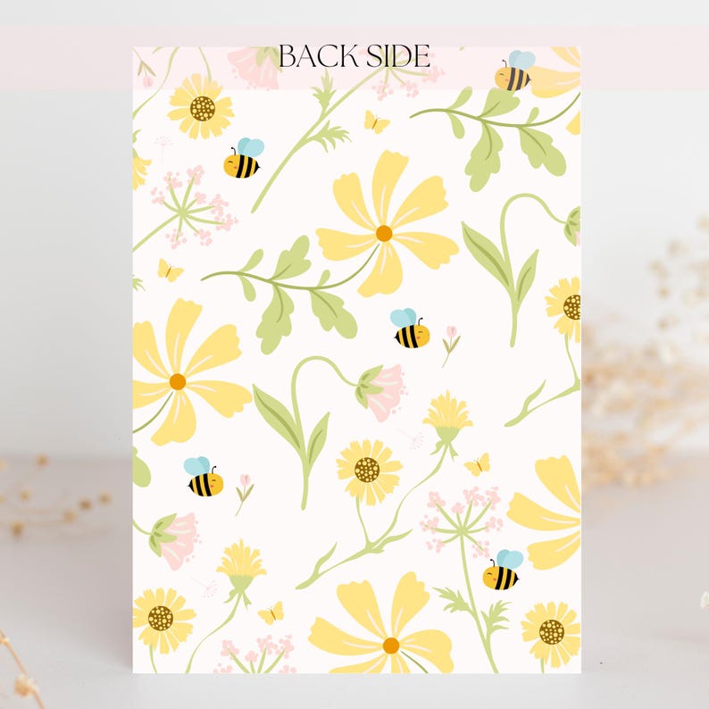 May include: A card with a floral pattern featuring yellow flowers, green leaves, small pink flowers, butterflies, and bees on a white background. The text "BACK SIDE" is at the top.