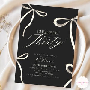 May include: Black and white birthday invitation with white ribbon bows and the text "Cheers to Thirty" and "Olivia's 30th Birthday!" RSVP to Jessy at 123-456-7789.