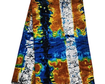 May include: A folded fabric with a vibrant abstract pattern. The design features a mix of colors, including blue, orange, yellow, and white, with a cracked or marbled effect. The fabric is likely intended for clothing or crafts.