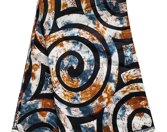 May include: Folded fabric with a repeating pattern of black, white, blue, and brown swirls. The fabric has a wax block print design. The design features a mix of geometric shapes and organic forms.