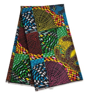 May include: Folded fabric with a vibrant geometric pattern. The design features a mix of shapes, including circles and squares, in a variety of colors such as black, green, yellow, pink, and blue. The fabric has the text "HITARGET" printed on it.