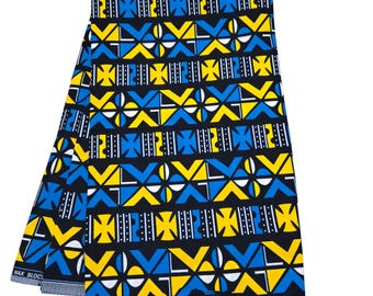 May include: A black, yellow, and blue African wax print fabric with a geometric pattern. The fabric is folded in half and has the text "Guaranteed Wax Block" printed on the bottom edge.