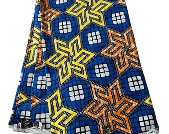 May include: Blue, yellow, and orange African wax print fabric with a geometric pattern of stars and squares. The fabric is labeled "Superwax".