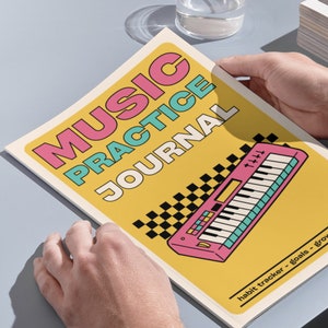 May include: A music practice journal with a yellow cover featuring the text MUSIC PRACTICE JOURNAL in pink and teal. The cover includes a graphic of a pink keyboard and a black and white checkered pattern, with the text habit tracker - goals - grow.