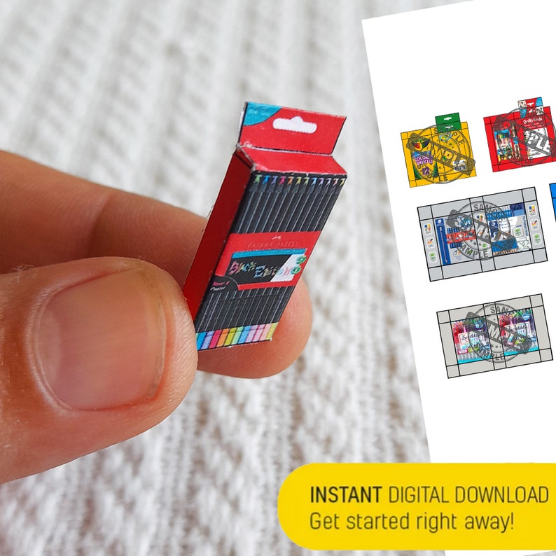 May include: A miniature papercraft model of a box of colored pencils. The box is red with a white label that says "Faber-Castell, 120/12,  Basic  Edding, Super &  Polychromos, Water &  Pencil".