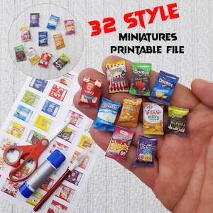 May include: A selection of miniature chip packets, including brands such as Doritos and Lays, are held in a hand. The image also shows a sheet of printed chip packet designs, scissors, glue, and a craft knife. Text reads "32 STYLE MINIATURES PRINTABLE FILE."