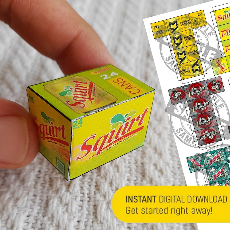 May include: A yellow and green cardboard box with the words "Squirt Thirst Quencher" and "24 Cans" printed on it. The box is a miniature replica of a soda can box.