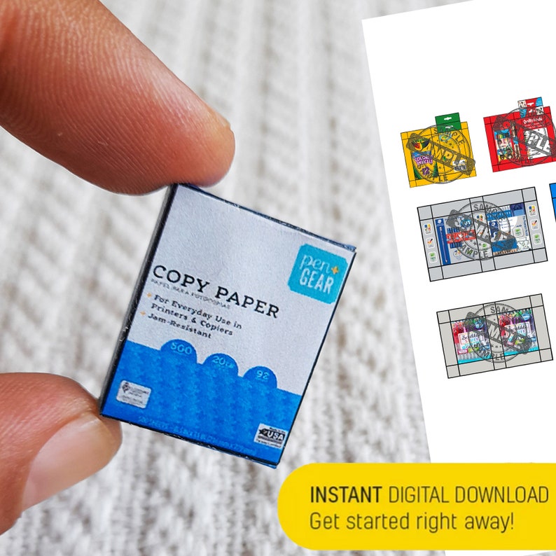 May include: A miniature box of copy paper with the brand name "pen+GEAR" printed on the front. The box is blue, white, and yellow and says "COPY PAPER" in black text. The box is labeled "500 20# 92" and says "For Everyday Use in Printers & Copiers" and "Jam-Resistant".