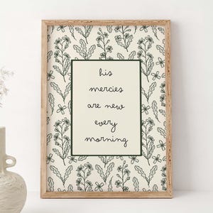 May include: A set of three ceramic mugs with a speckled, matte finish. The mugs are in shades of cream, light gray, and dark gray. Each mug has a simple, modern design and a rounded handle. The mugs are stacked on top of each other.