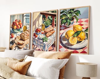 May include: Three framed watercolor paintings depicting still life scenes. The first painting shows a bowl of red tomatoes, a loaf of bread, and a cutting board. The second painting shows a bowl of red tomatoes, a loaf of bread, and a bowl of mozzarella cheese. The third painting shows a plate of lemons on a red and white checkered tablecloth.