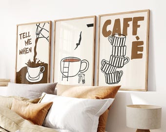May include: Three framed art prints with coffee-themed illustrations. The prints feature a coffee cup, a diver, and the word "CAFFÈ" with stacked coffee cups. The artwork is in brown and black on a cream background.
