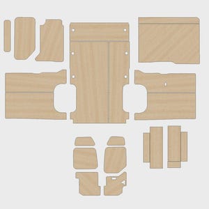 May include: A set of pre-cut wooden panels in a light colour, possibly for a vehicle. The various shapes and sizes include pieces with rounded edges and pre-drilled holes. The layout suggests a kit for assembly, potentially for flooring or interior panelling.