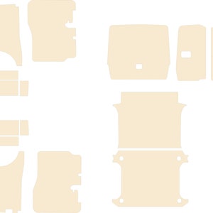 May include: A set of beige car interior trim pieces. The pieces are made of a soft, flexible material and are designed to fit the contours of the car's interior. The set includes pieces for the dashboard, door panels, and other areas.