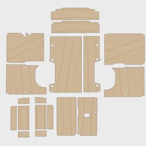 Puede incluir: Un conjunto de paneles de madera precortados, de color claro, dispuestos sobre un fondo blanco. Las piezas varían en tamaño y forma, incluyendo diseños rectangulares, curvos y con muescas, probablemente para un proyecto de bricolaje o la construcción de muebles.