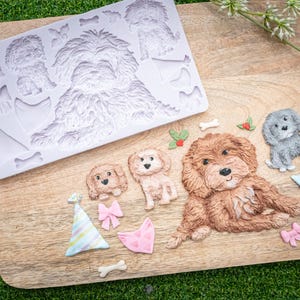 May include: A set of three ceramic mugs with a speckled, matte finish. Each mug features a different color: light blue, cream, and gray. The mugs have a simple, modern design with a rounded shape and a comfortable handle.