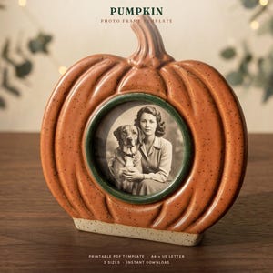 May include: A pumpkin-shaped photo frame with a glossy orange finish and dark speckles. The center features a circular opening displaying a black and white photograph of a person and a dog. Text at the top reads PUMPKIN PHOTO FRAME TEMPLATE.