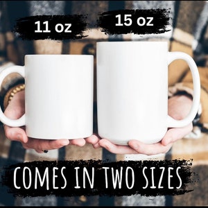 May include: Two white ceramic mugs, one 11 oz and the other 15 oz, are displayed. The mugs have large handles and a simple, clean design. The text "COMES IN TWO SIZES" is written in white on a black background.