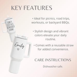 May include: Two white insulated tumblers with handles and lids. One tumbler has the text "COMFY CLOTHES & MURDER SHOWS". The other tumbler has the name "Emily" and a heart symbol. Both tumblers have a reusable straw.