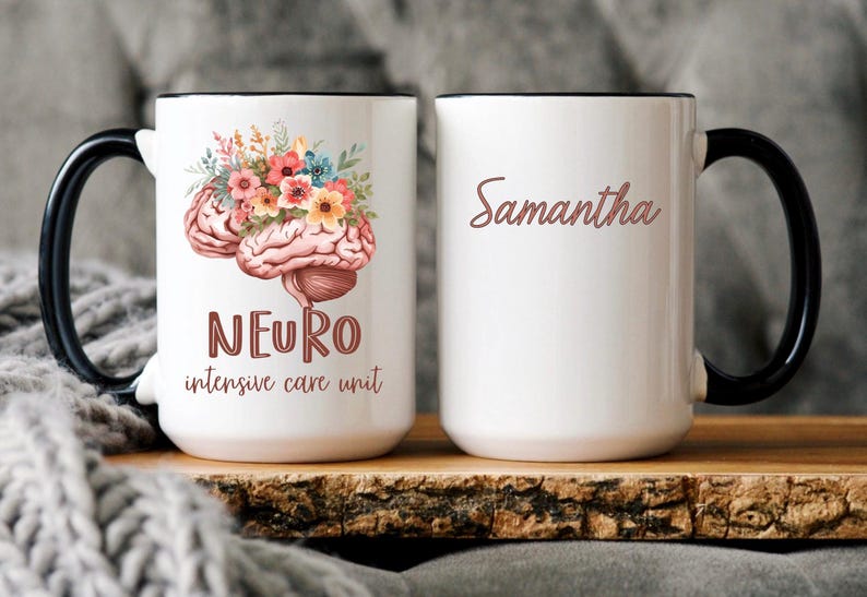 May include: White ceramic mug with a black handle and rim. One side features a brain illustration adorned with flowers, the word "NEURO", and "intensive care unit". The other side displays the name "Samantha" in a script font.
