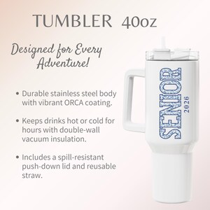 May include: White 40oz tumbler with a handle, featuring the word "SENIOR" in blue floral lettering and the year "2026". Includes a lid and straw. The text "Designed for Every Adventure!" is also present.