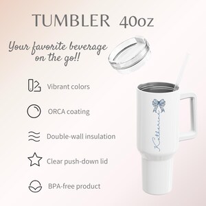 May include: White 40oz tumbler with a handle, lid, and straw. Features a blue bow design and the name "Katherine" in script. Text includes "Your favorite beverage on the go!!", and details about vibrant colors, ORCA coating, and double-wall insulation.