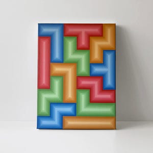 May include: A colorful abstract geometric canvas art piece. The artwork features a pattern of interlocking shapes in shades of red, blue, green, and orange. The shapes are arranged in a layered, three-dimensional effect.