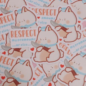 May include: A sticker featuring a cartoon bunny holding a knife with the text "Respect my pronouns...or else..." in pink and brown lettering. The bunny is white with a blue collar and pink cheeks. The sticker is surrounded by other similar stickers.