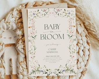 May include: A baby shower invitation with a floral border and the text "Baby in Bloom" and "Carrie Marshall".