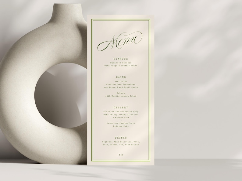 May include: A rectangular menu card with a green border and elegant script font. The word "Menu" is at the top, with a list of courses below. The background is a soft beige colour.