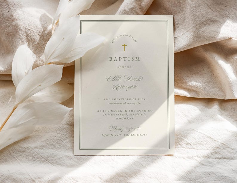 May include: A baptism invitation card with a cream background and a gold cross at the top. The text includes the name "Oliver Thomas Harrington" and the date "The Twentieth of July". The card is framed with a thin, dark green border.