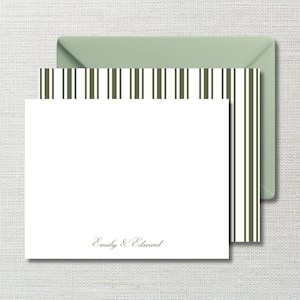 May include: White stationery set with a green envelope. The stationery features a striped design in olive green and white. The text "Emily & Edward" is printed in a delicate script at the bottom of the card.