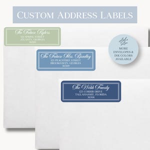 May include: Three rectangular custom address labels with rounded corners, each featuring white text on a solid background. The labels are sage green, light blue, and navy blue, applied to white envelopes. A circular sticker reads Lake & Lou.