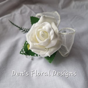 Wedding single ivory rose buttonhole with pearl loops and ivory organza bow