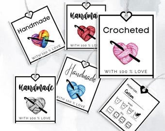 May include: Five white square gift tags with black borders and hearts. Each tag features a crocheted heart with yarn and a crochet hook. The text on the tags reads "Handmade with 100% Love" and "Crocheted with 100% Love". One tag has a separate section with the text "Materials: Cotton" and washing instructions.